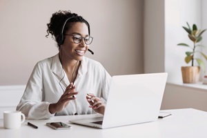 woman using laptop for a virtual meeting