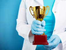 researcher holding a trophy