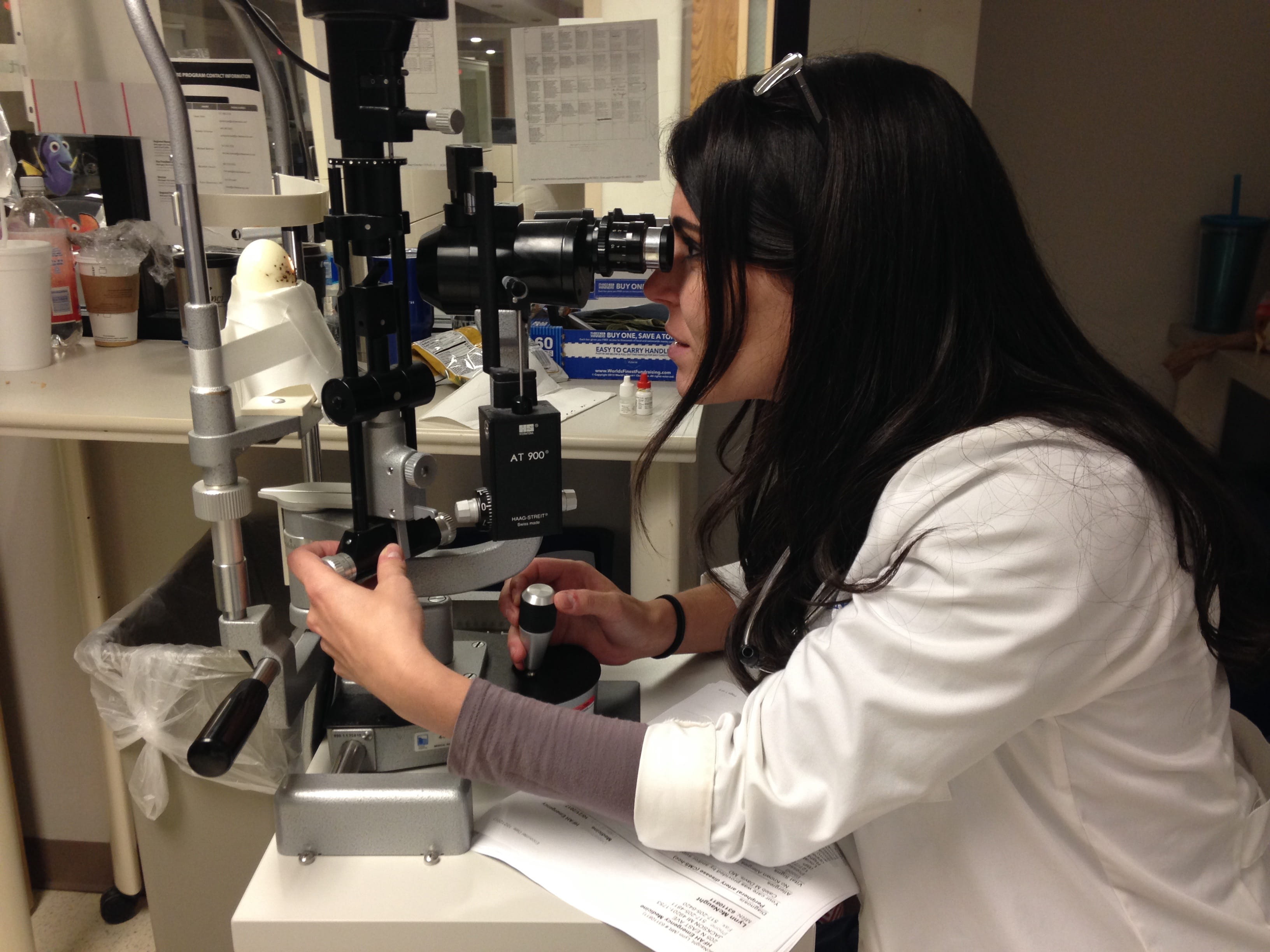 Resident looking into microscope