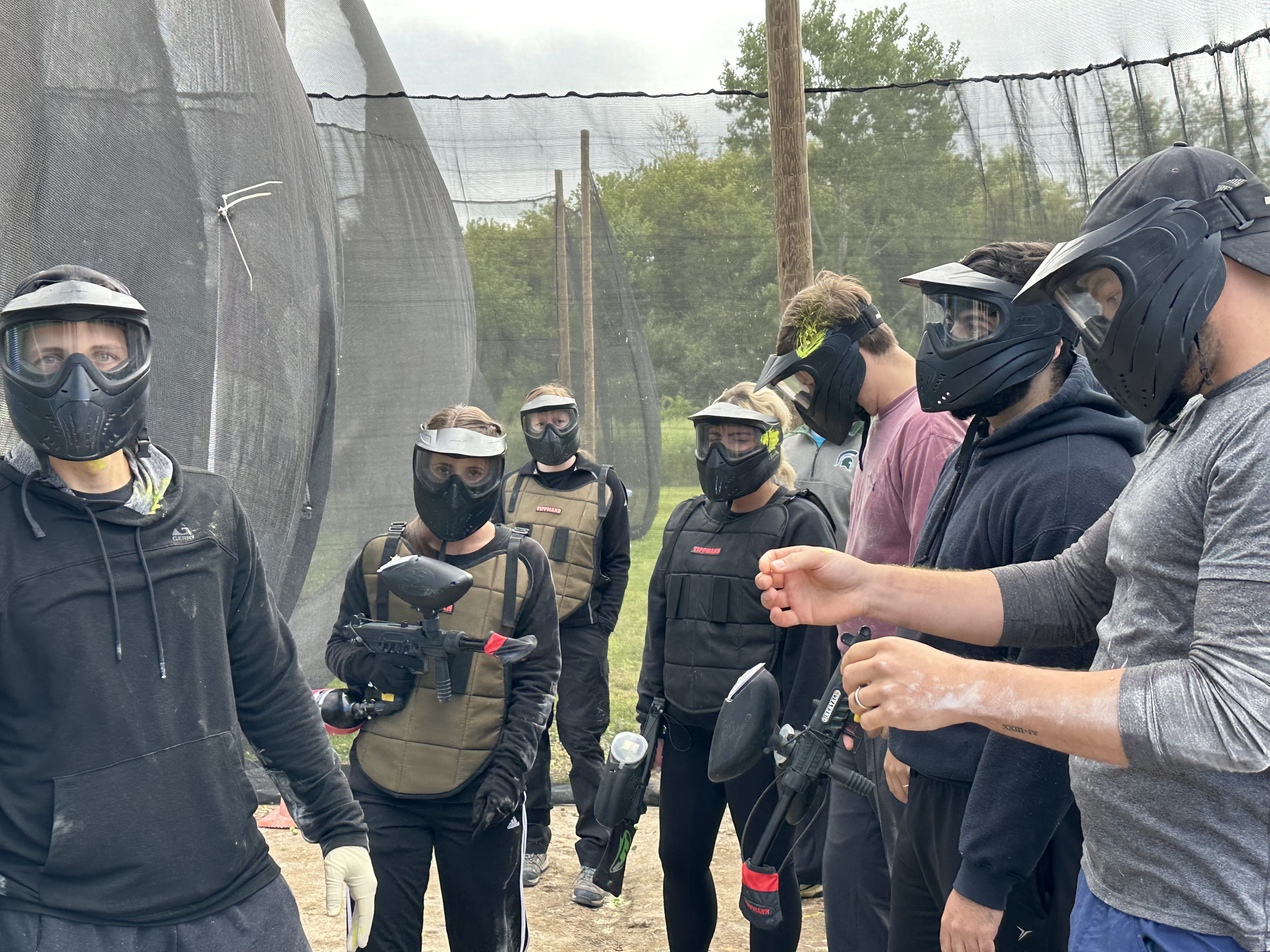 Residents playing paintball