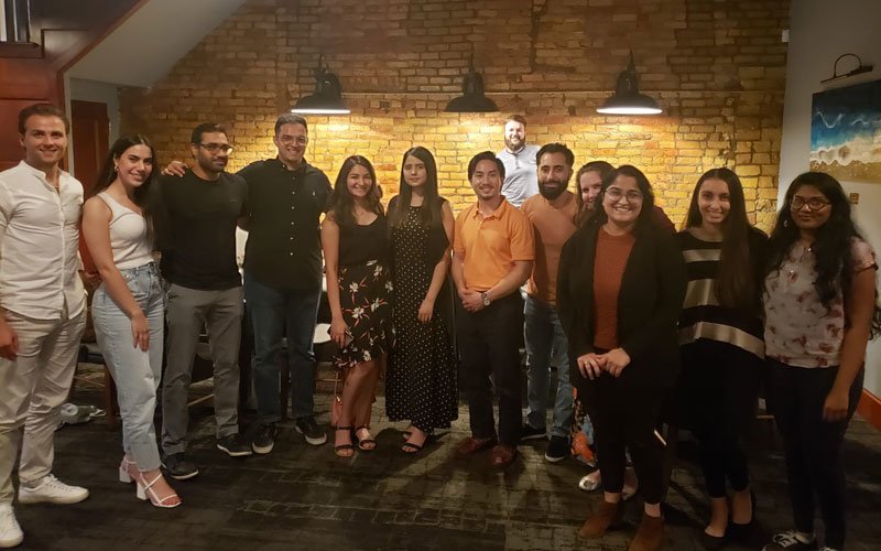 group of people standing together inside