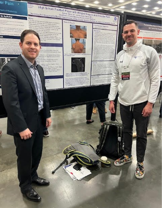 Faculty with research poster
