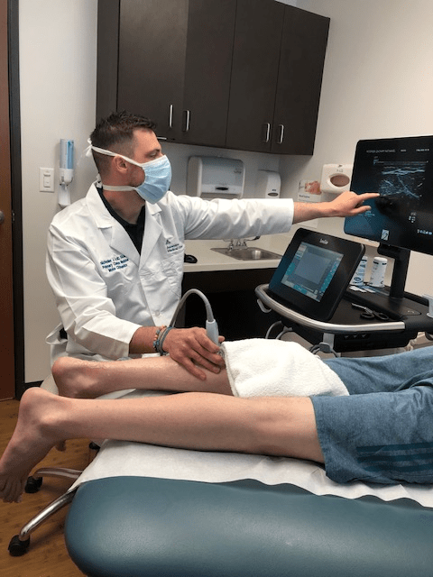 Dr Moore in clinic with patient