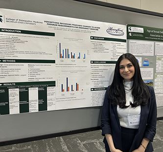 Resident with her poster presentation