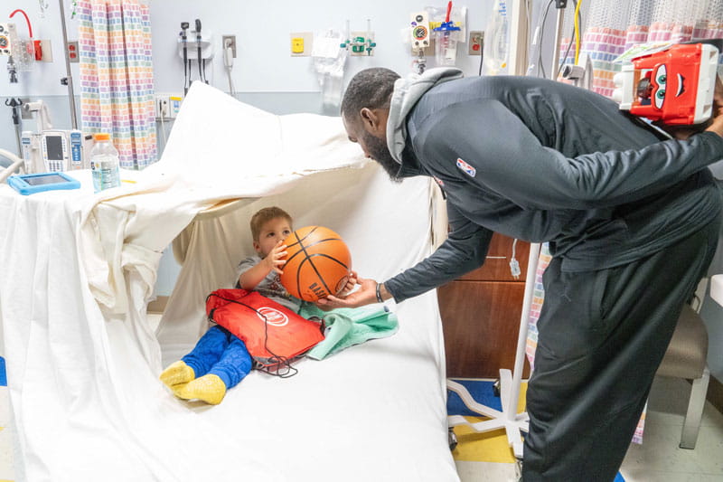 Detroit Pistons player visiting kids on the inpatient unit at Henry Ford St. John Hospital