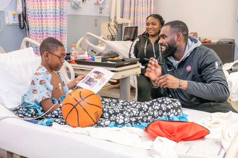 Detroit Pistons player visiting kids on the inpatient unit at Henry Ford St. John Hospital