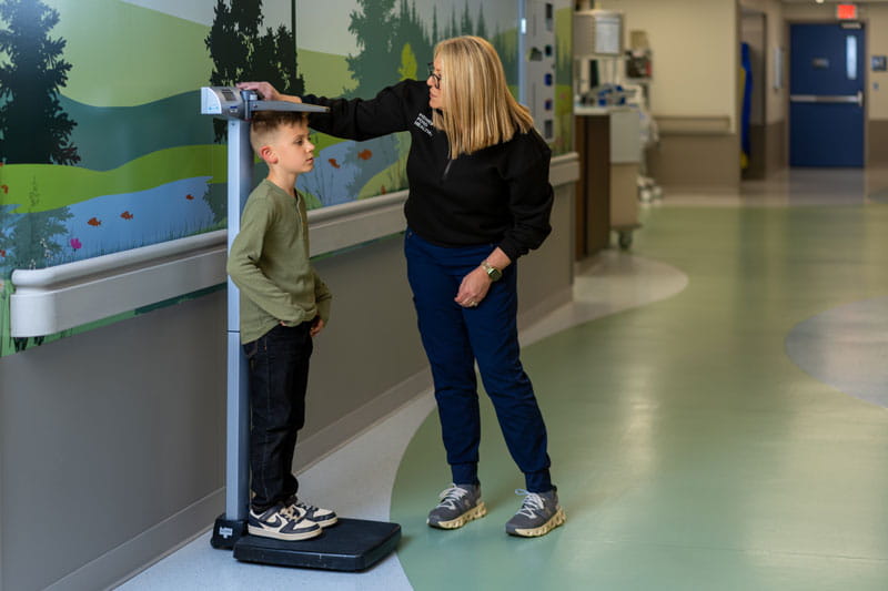 Patient having their height taken