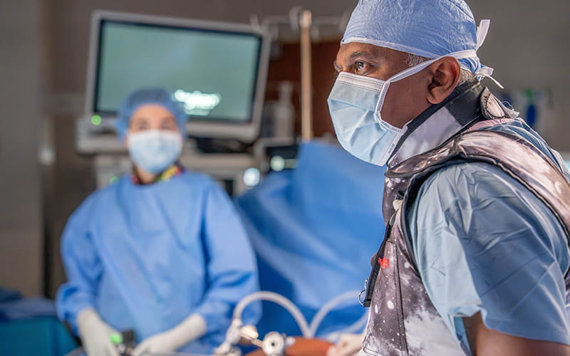 Resident and doctor in a surgery room