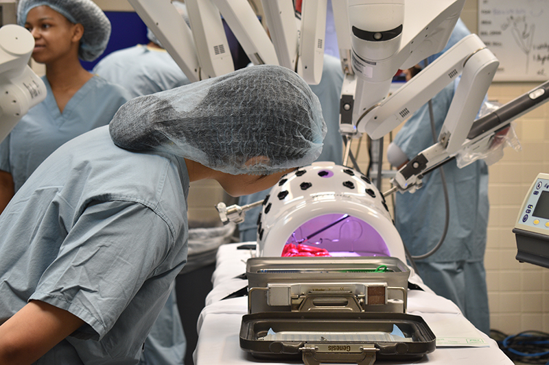 Student observing robotic demonstration