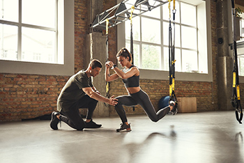 Athletic trainer working with patient or athlete