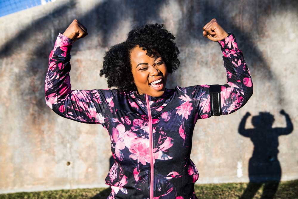 woman smiling and posing working out
