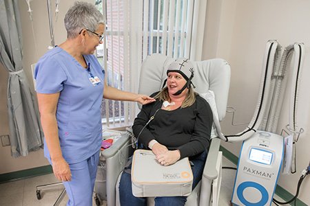 breast cancer patient laura carey getting treatment with paxman scalp cooling system