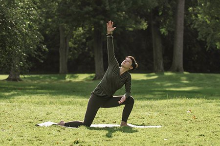 Breast Cancer Patient Miranda doing yoga stretches story