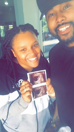 Dorthilen holding up pictures