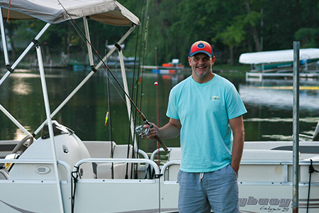 Ron fishing off pontoon boat