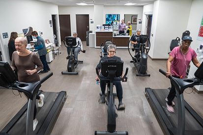 Recovering cancer patients exercising to a specially developed program from a oncology specialist.