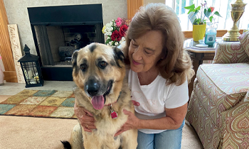 Pancreatic cancer patient, Margo, petting her dog
