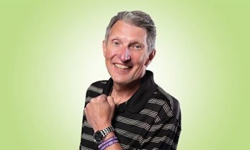 Pancreatic cancer patient, Harry, smiling with fist on chest