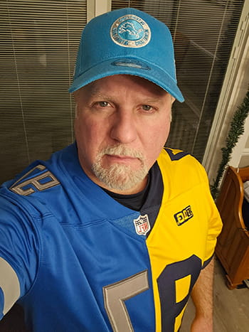 Prostate cancer patient Michael wearing a football jersey