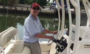 Prostate cancer patient, Thomas, driving his boat