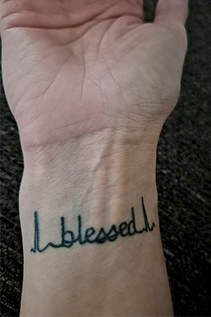 Kell's EKG tattoo on her hand