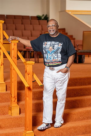 Reverend Anthony posed inside his church