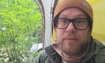 Eric taking a selfie while camping