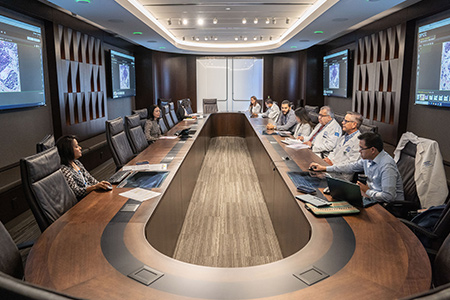 Team of Neuroendocrine experts sitting around table