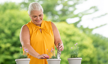 rehab patient stephanie planting flowers