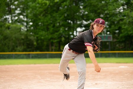 athlete throwing baseball