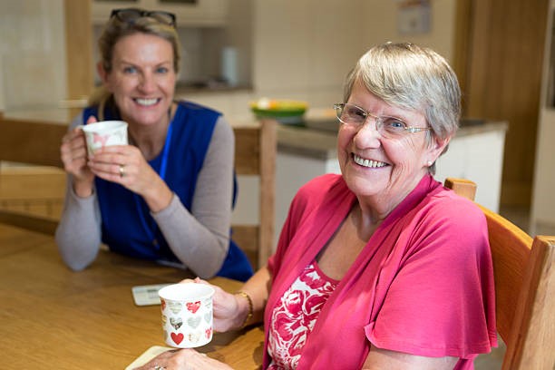 Two women drinking coffee