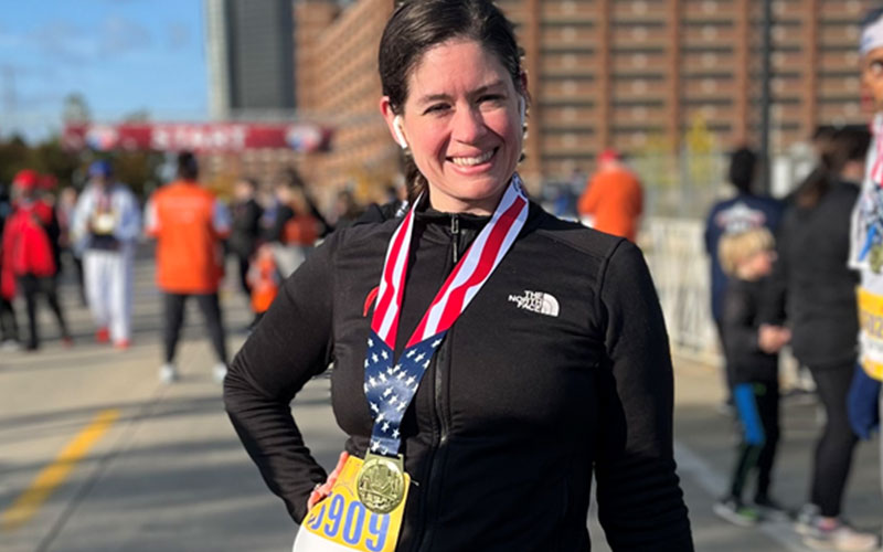 nancy with marathon medal