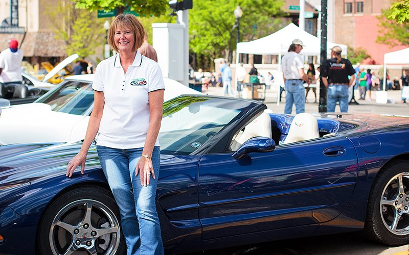 Joint replacement patient Beth Waters by her Corvette