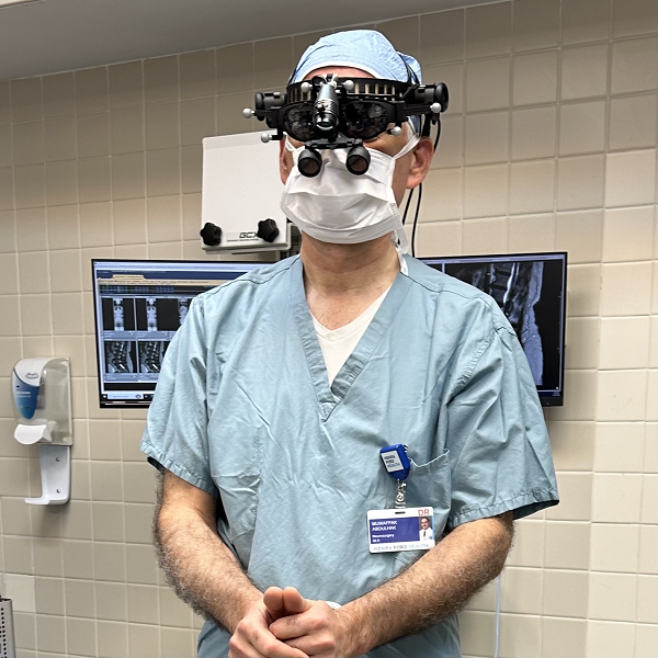 Henry Ford Health Neurosurgeon Dr. Muwaffak M. Abdulhak shows off the headset he used when completing the first complex spinal surgery in the U.S. using the OnPoint augmented reality technology on Aug. 8. 2024, in Detroit. 