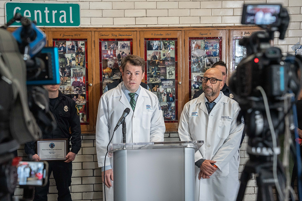 Henry Ford Health physicians Dr. Matthew Ball, left, and Dr. Amjad Farha speak at Celest Cole's "second birthday" on Feb. 7, 2025 in Detroit.