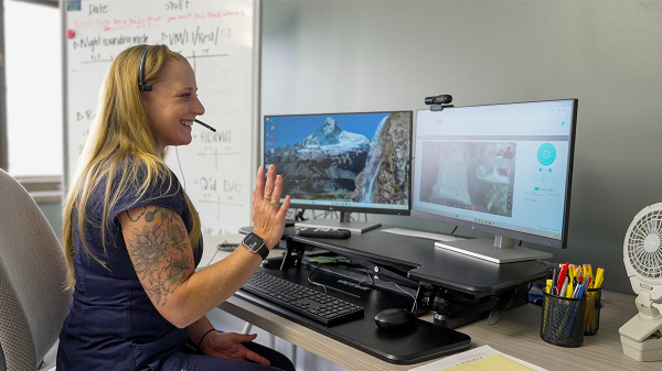 Virtual nurse works at computer