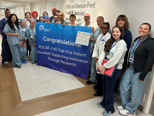 Medical professionals posing to celebrate a milestone